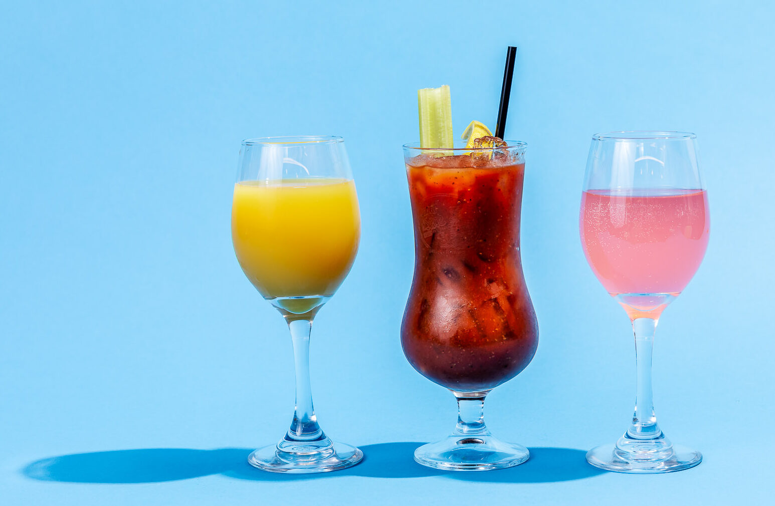 Spiked OJ, Bloody Mary, and a pink mimosa